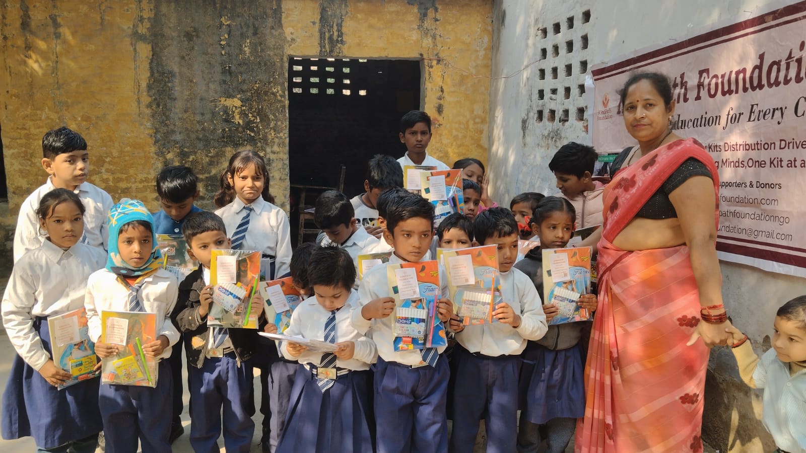 Mrs. Kamini Gupta leading a Kindpath Foundation stationery drive with children
